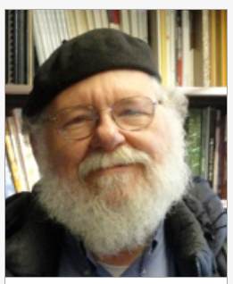 man wearing beret and glasses with white beard