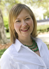 blonde woman outside smiling