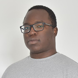 man wearing glasses and a gray t-shirt