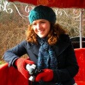 woman in green hat with brown hair